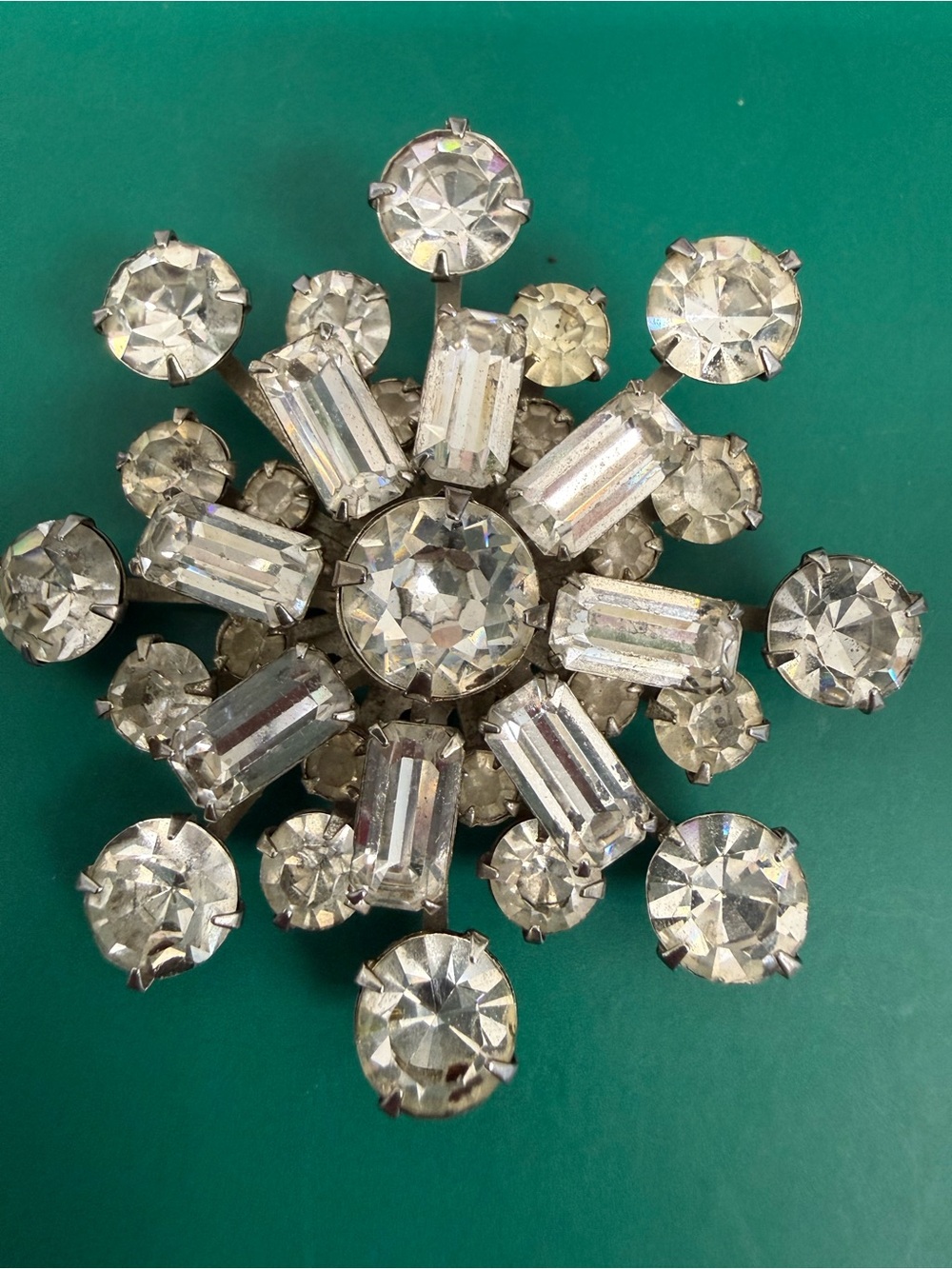 Vintage starburst Brooch prominent center stone emerald cut baguette rhinestone